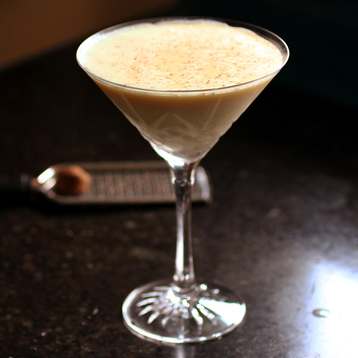 https://oldblackbear.com/wp-content/uploads/2023/12/ginger-eggnog-martini-with-grated-nutmeg.jpg